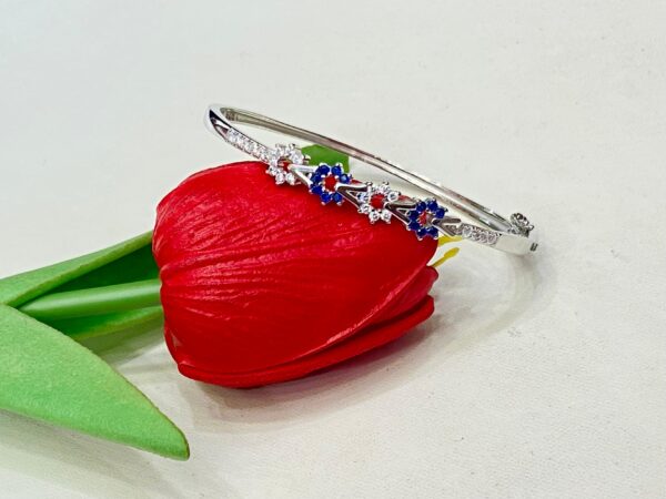 WhatsApp Image 2025-11-22 at 3.24.46 PM 92.5 Pure Silver Blue Stone Floral V Design Bracelet (CN 11/170)